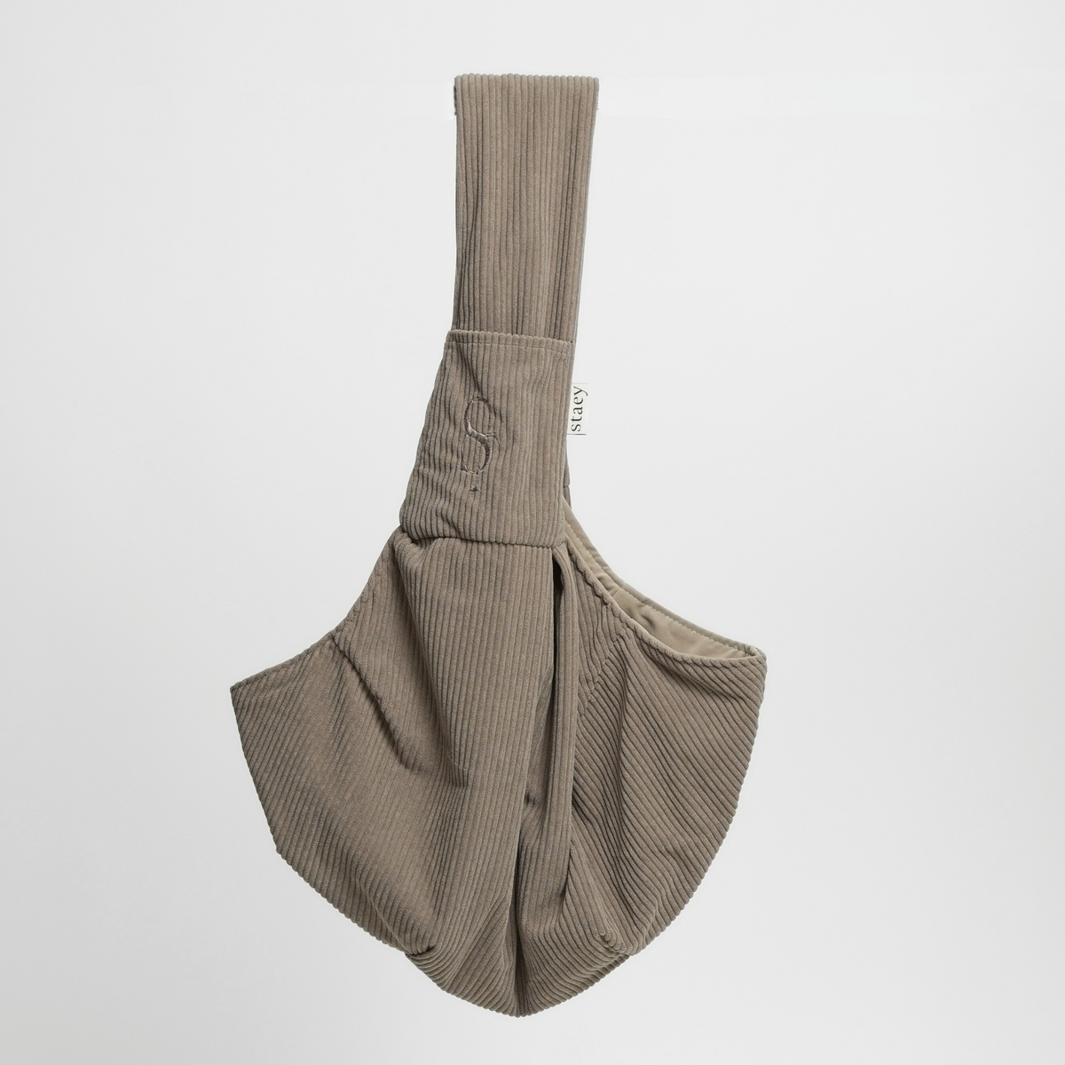 Taupe corduroy sling carrier for small dogs, seen from the side