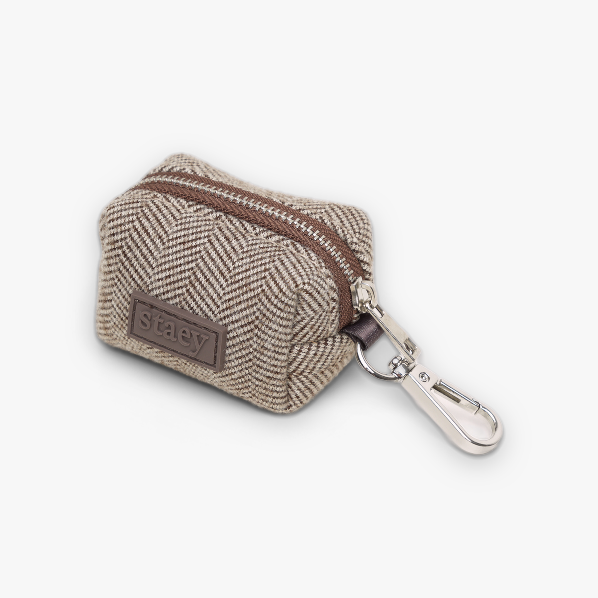 Elma-poepzakjeshouder in Herringbone-motief met een zilveren karabijnhaak