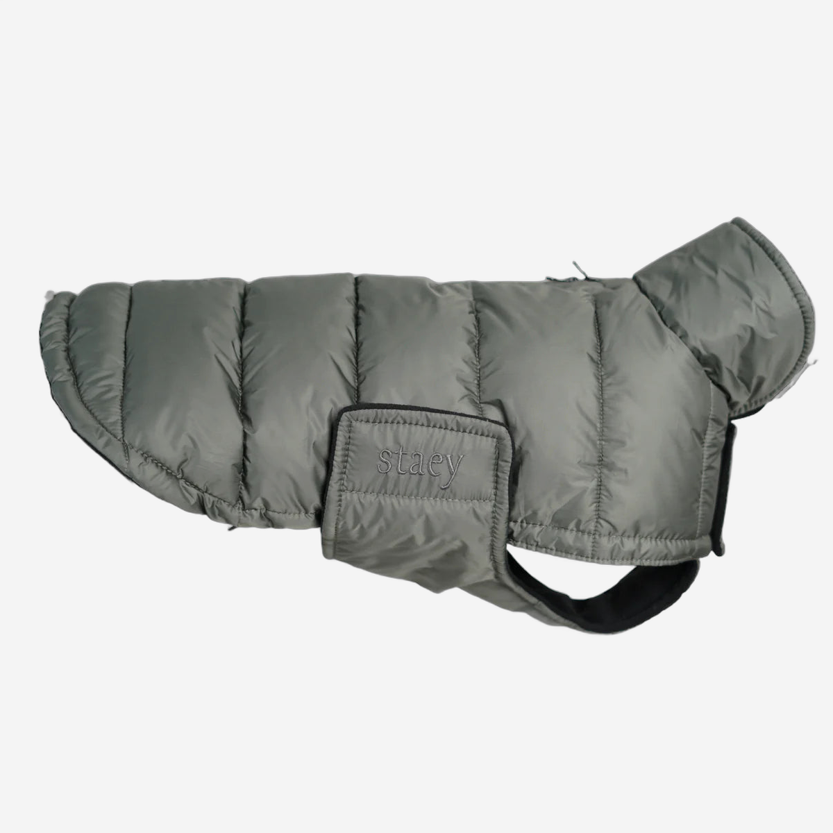 Nora quilted dog coat in moss green with embossed Staey patch, side view